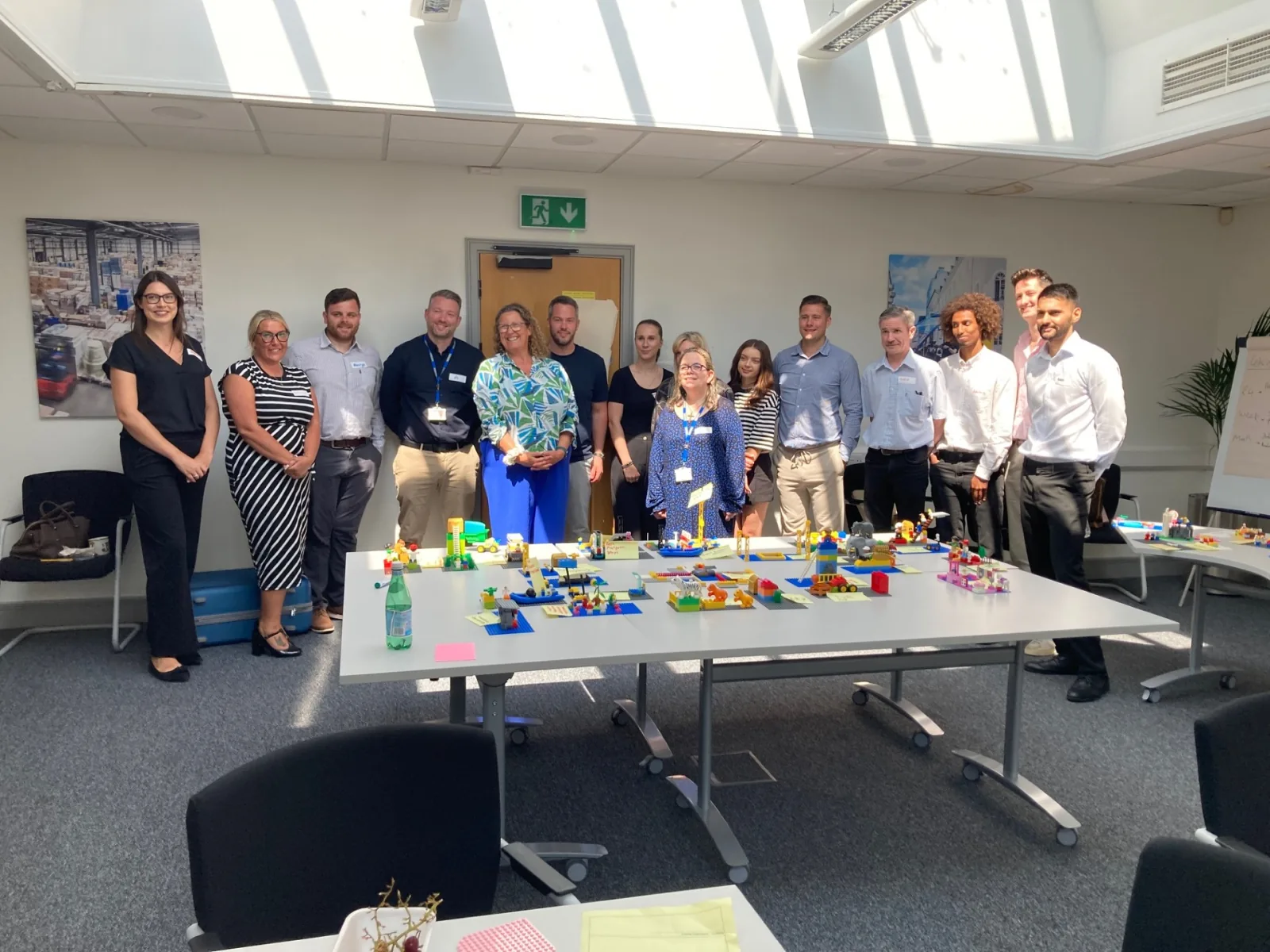 Dachser workshop team standing behind their LEGO® Serious Play® models